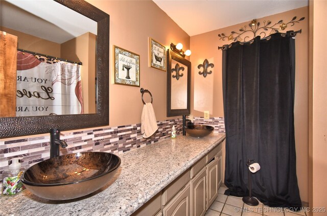 3001 Bacon Rd, Muskogee, OK 74403 - full bathroom with backsplash, tile patterned flooring, double vanity, and a sink