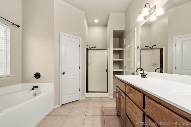 full bath with double vanity, a bath, tile patterned floors, a sink, and a stall shower