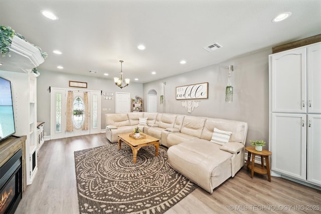 539 N Gunter St, Vinita, OK 74301 - living area featuring visible vents, light wood finished floors, and recessed lighting