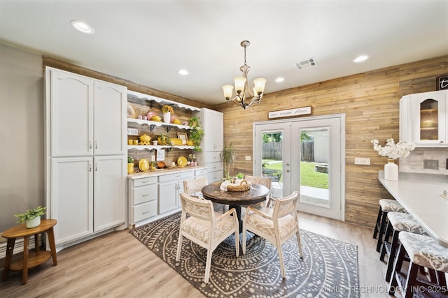 539 N Gunter St, Vinita, OK 74301 - dining room with visible vents, recessed lighting, light wood finished floors, french doors, and a notable chandelier
