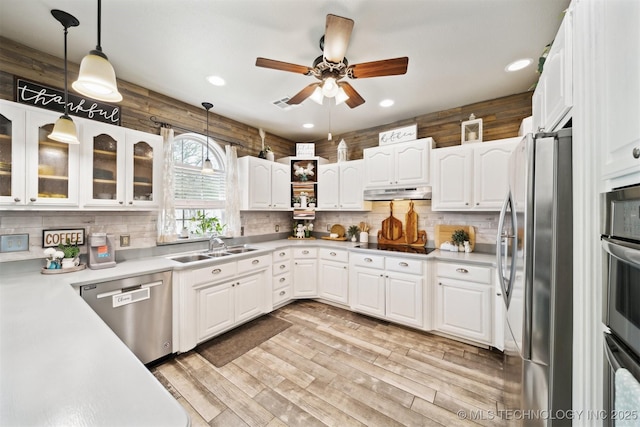 539 N Gunter St, Vinita, OK 74301 - kitchen featuring a sink, under cabinet range hood, ceiling fan, black appliances, and white cabinets