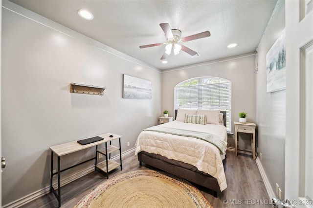 539 N Gunter St, Vinita, OK 74301 - bedroom featuring baseboards, wood finished floors, and ceiling fan