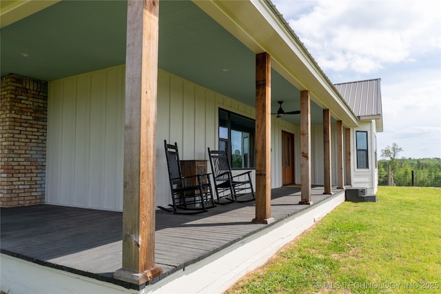 view of patio / terrace featuring a deck and ceiling fan