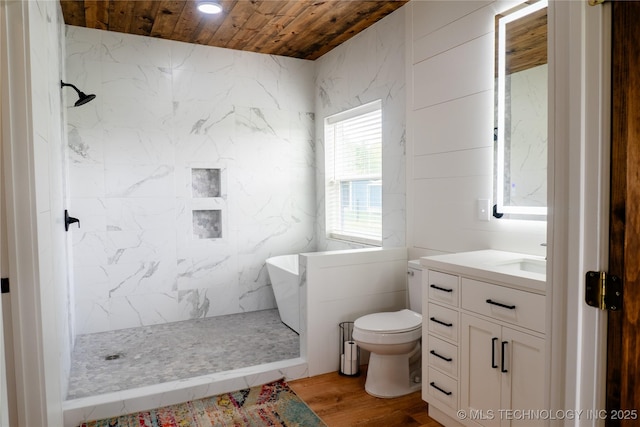 bathroom with wooden ceiling, tiled shower, vanity, toilet, and wood finished floors