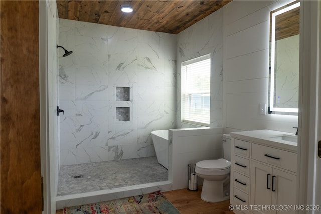 bathroom featuring tiled shower, vanity, toilet, wood ceiling, and wood finished floors