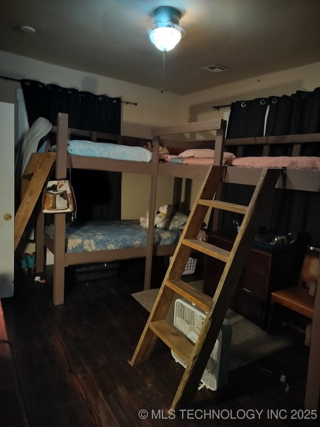bedroom with wood finished floors