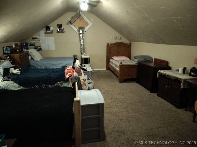 bedroom with vaulted ceiling and carpet floors