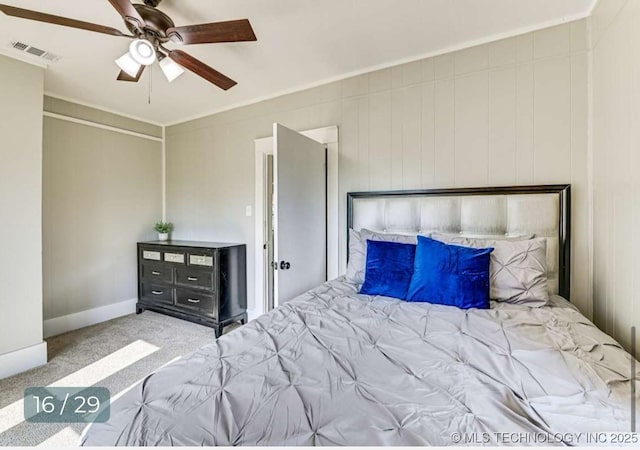 carpeted bedroom with baseboards, visible vents, and ceiling fan