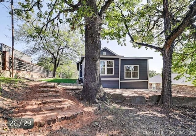 view of home's exterior featuring fence