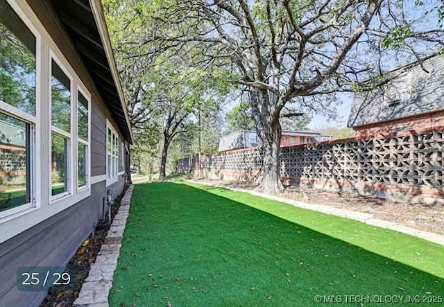 view of yard with fence