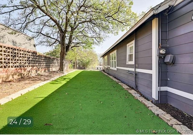 view of yard with fence