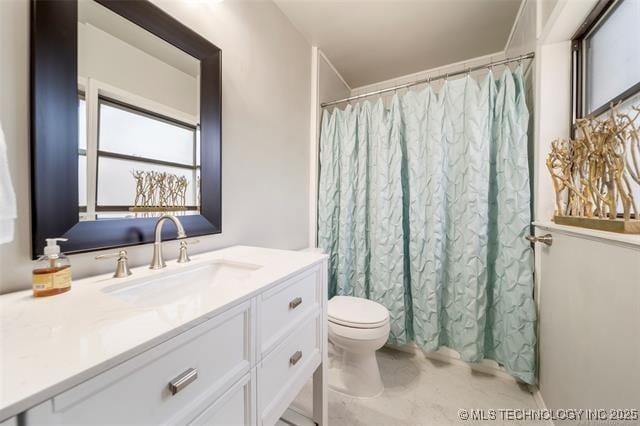 bathroom with vanity, toilet, and a shower with curtain
