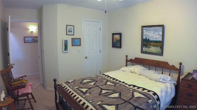 carpeted bedroom featuring baseboards