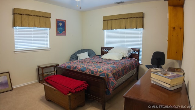 bedroom featuring baseboards, visible vents, and carpet floors