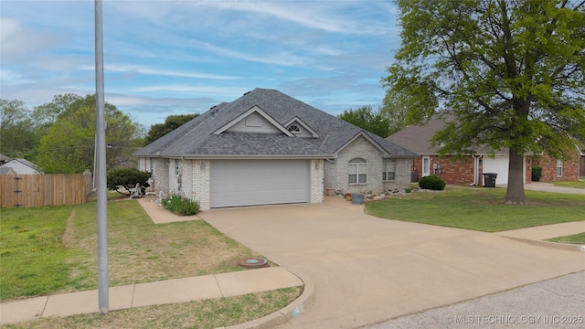 ranch-style home featuring a shingled roof, driveway, brick siding, an attached garage, and fence