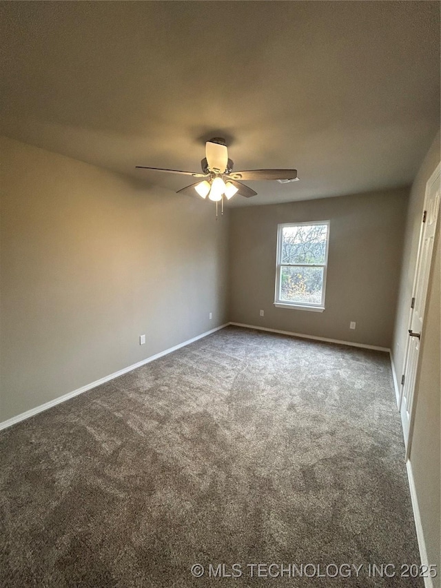 carpeted empty room with baseboards and a ceiling fan
