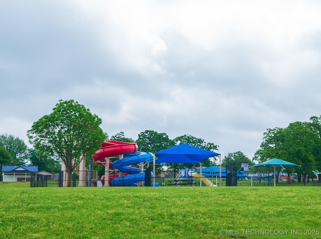 community playground with fence and a yard