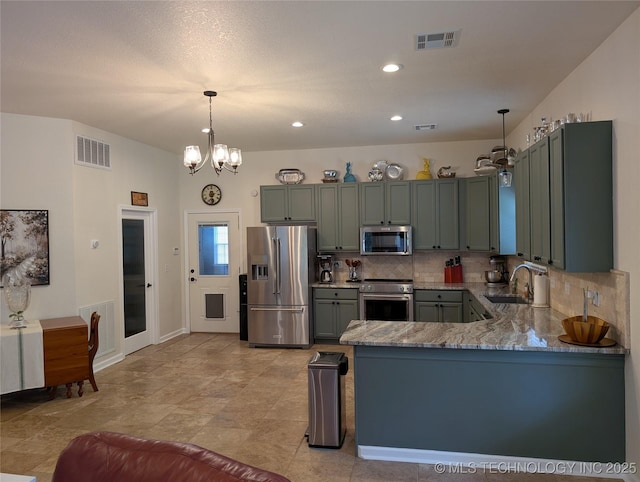 277 Oak Hollow Rd, Eufaula, OK 74432 - kitchen featuring appliances with stainless steel finishes, a sink, tasteful backsplash, light stone countertops, and decorative light fixtures