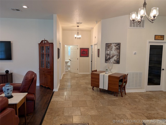277 Oak Hollow Rd, Eufaula, OK 74432 - entryway with a chandelier, stone tile flooring, and baseboards