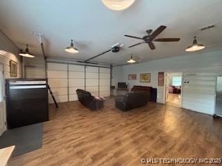 277 Oak Hollow Rd, Eufaula, OK 74432 - living room with a garage, wood finished floors, and ceiling fan