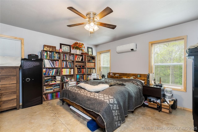 65365 E 155th Rd, Wyandotte, OK 74370 - bedroom featuring baseboards, a ceiling fan, concrete flooring, and an AC wall unit