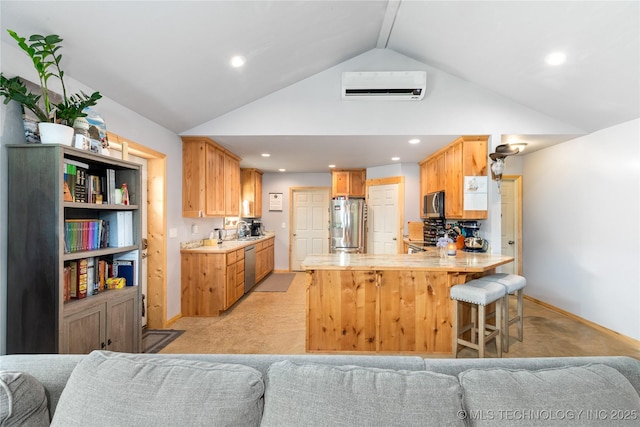 65365 E 155th Rd, Wyandotte, OK 74370 - kitchen featuring a wall mounted AC, open floor plan, a peninsula, appliances with stainless steel finishes, and light colored carpet