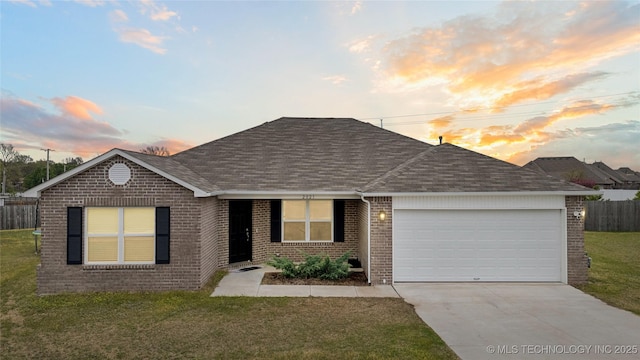 view of front of property featuring driveway, a shingled roof, brick siding, and a garage