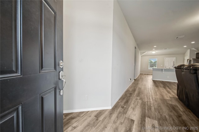 entrance foyer featuring baseboards, recessed lighting, wood finished floors, and visible vents