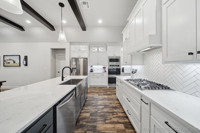 1992 E 173rd St S, Mounds, OK 74047 - kitchen with visible vents, beam ceiling, dark wood-style floors, a sink, and stainless steel appliances