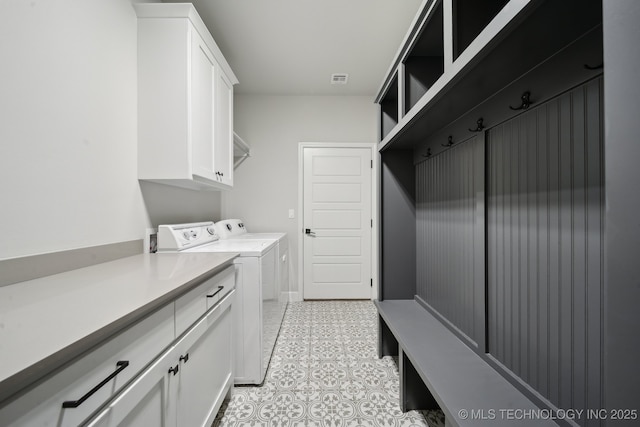 1992 E 173rd St S, Mounds, OK 74047 - laundry area featuring visible vents, cabinet space, baseboards, light tile patterned flooring, and washer and dryer