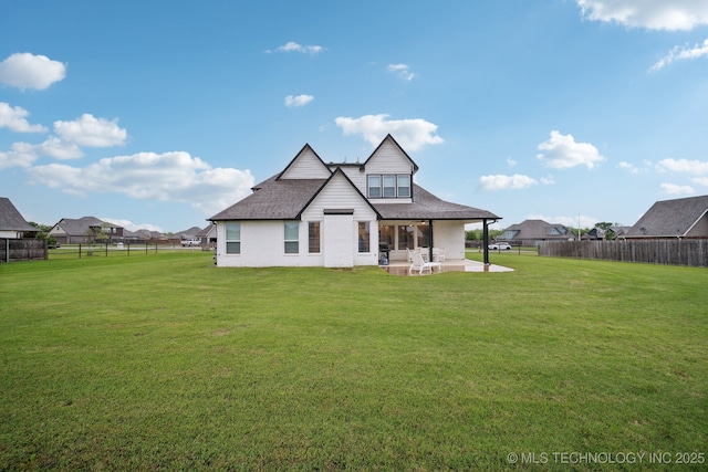 1992 E 173rd St S, Mounds, OK 74047 - back of house featuring roof with shingles, a patio area, brick siding, a fenced backyard, and a yard