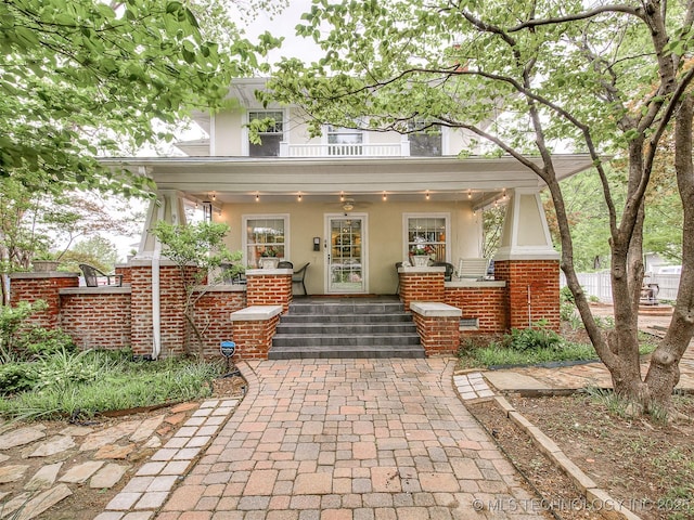 1805 W Easton St, Tulsa, OK 74127 - view of front of home featuring a porch, stucco siding, and brick siding