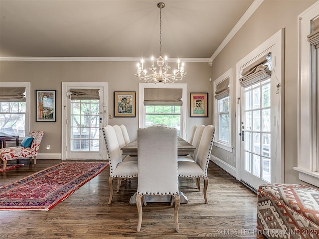 1805 W Easton St, Tulsa, OK 74127 - dining space featuring a chandelier, crown molding, and wood finished floors