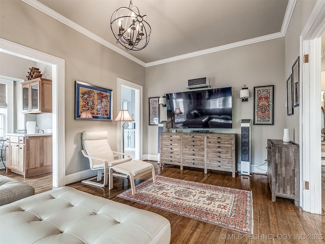 1805 W Easton St, Tulsa, OK 74127 - living room featuring wood finished floors, ornamental molding, and a chandelier