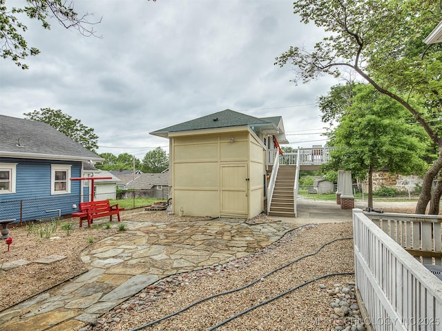 1805 W Easton St, Tulsa, OK 74127 - view of patio featuring stairway and an outdoor structure