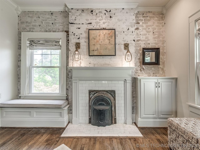 1805 W Easton St, Tulsa, OK 74127 - unfurnished living room with crown molding, wood finished floors, and a brick fireplace