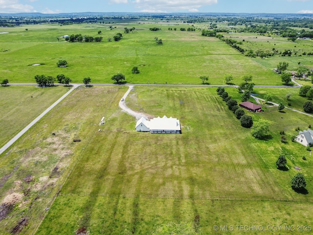 birds eye view of property featuring a rural view