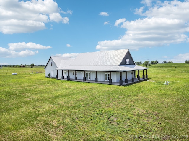 view of front of house featuring a front lawn and metal roof