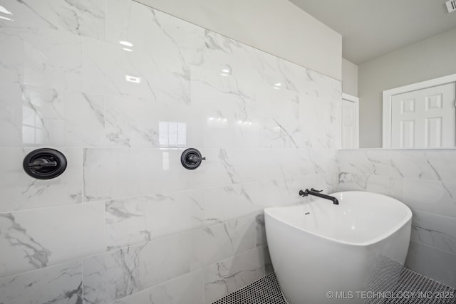 full bathroom with a soaking tub, visible vents, and tiled shower