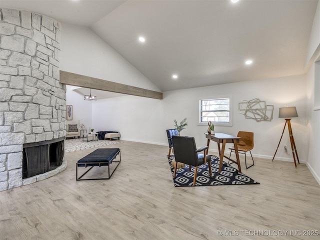 living room featuring wood finished floors, recessed lighting, and baseboards