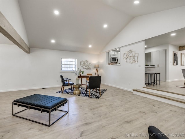 living area with baseboards, recessed lighting, and light wood finished floors