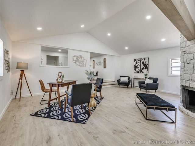 living room featuring recessed lighting, a fireplace, lofted ceiling, baseboards, and wood finished floors