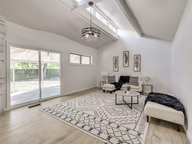 living room featuring visible vents, vaulted ceiling with beams, wood finished floors, and baseboards