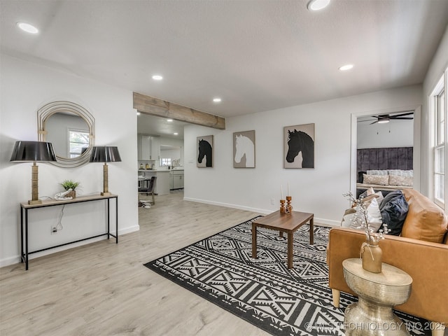 living room featuring recessed lighting, a ceiling fan, wood finished floors, and baseboards