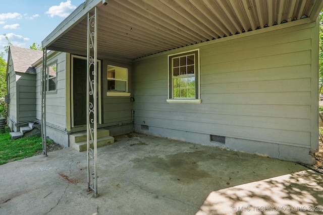 exterior space featuring entry steps and a carport