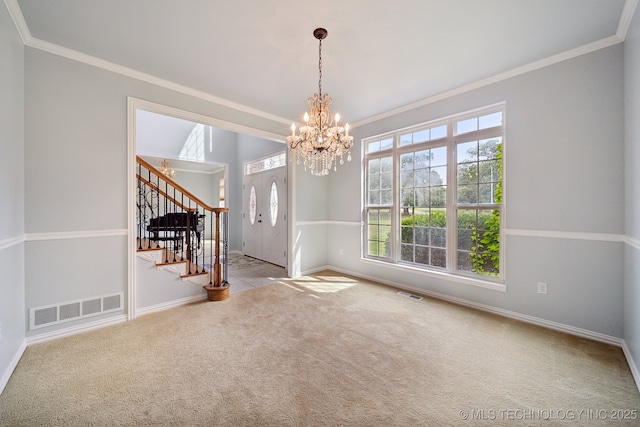 unfurnished dining area with a notable chandelier, visible vents, stairway, and carpet