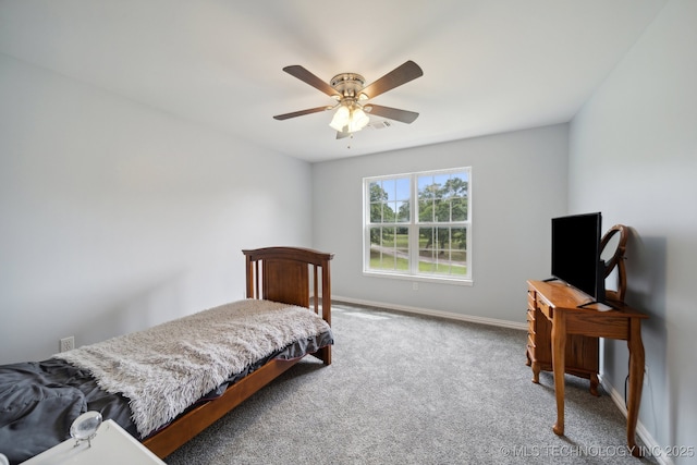 bedroom featuring a ceiling fan, carpet, and baseboards