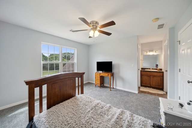 bedroom featuring carpet flooring, connected bathroom, ceiling fan, visible vents, and baseboards