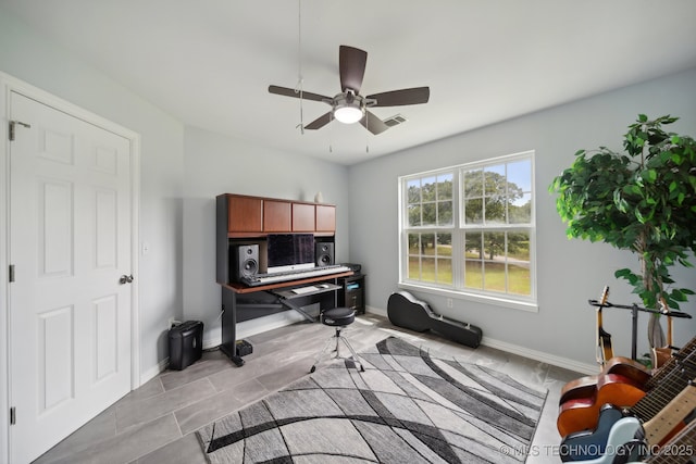 home office with baseboards, visible vents, light tile patterned floors, and ceiling fan