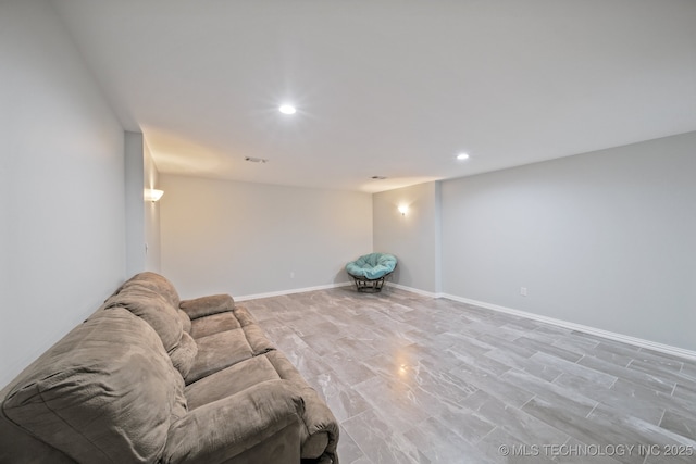 living area with recessed lighting and baseboards